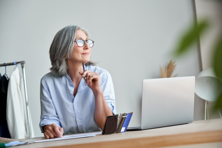 woman looking out the office window